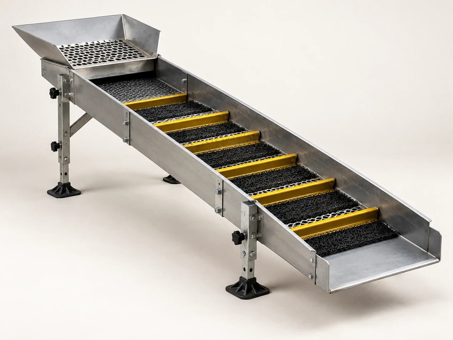 Sluices and jigs separate heavier gold particles from washed gravel using water flow and gravity.
