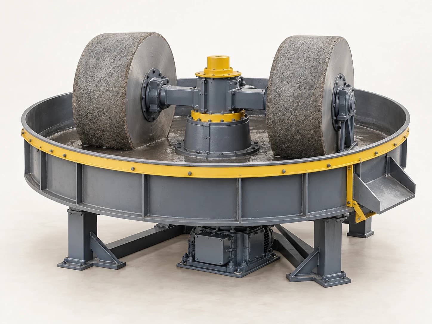 A wet pan mill grinds ore with heavy rollers moving around a pan containing water and feed material.