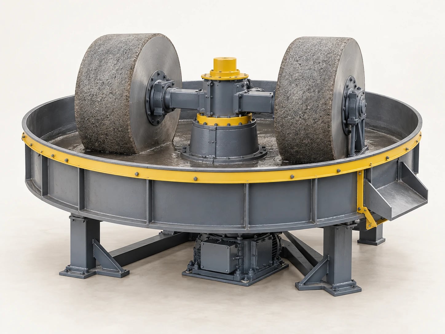 A wet pan mill grinds ore with heavy rollers moving around a pan containing water and feed material.