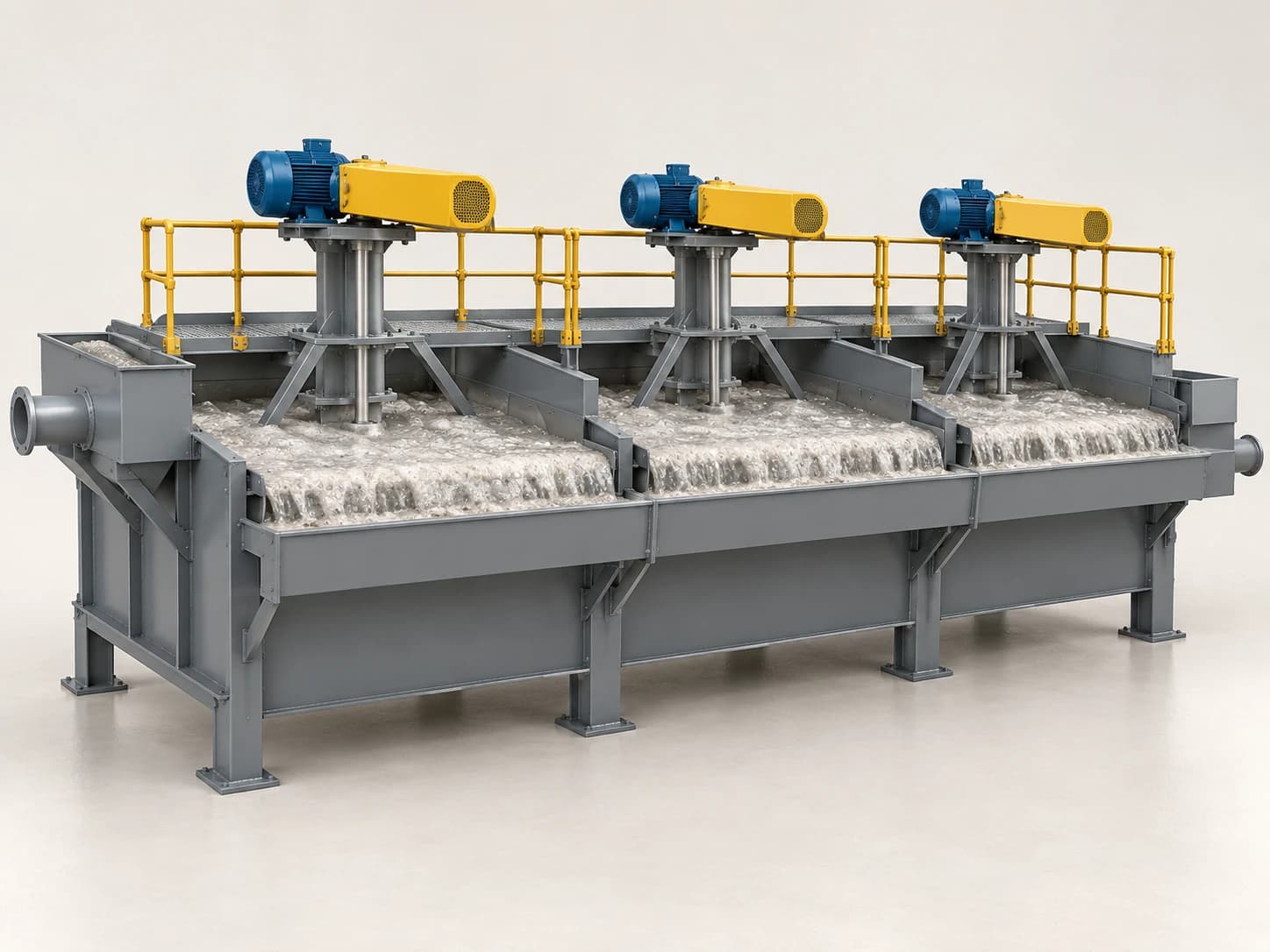 A bank of flotation cells with overhead drives and froth overflowing into the front launder